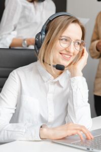 A woman wearing a headset during a customer conversation