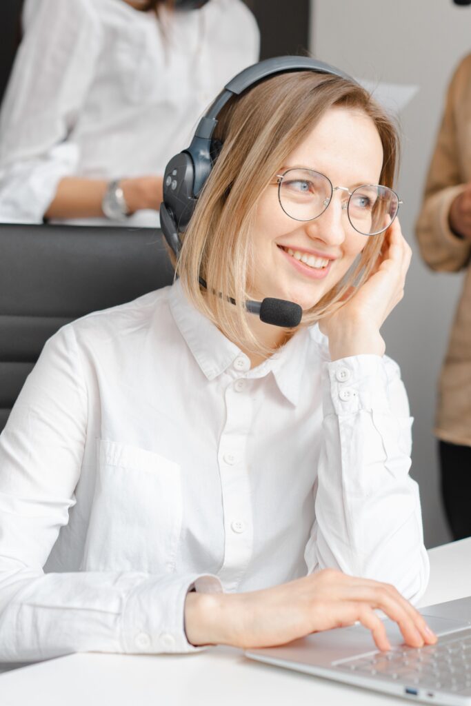 A woman wearing a headset during a customer conversation